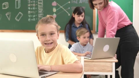 Caucasian cute boy focus on programing system while looking at camera. Pedagogy. Stock Footage 268621719