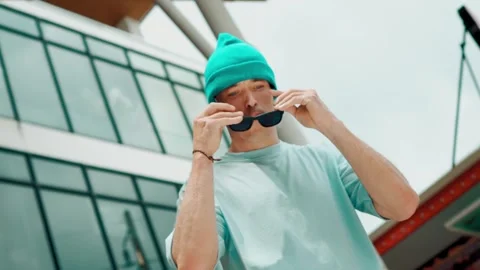 Caucasian dancer looking at camera while dancing at sky scrapper. hiphop. Stock Footage 268343663