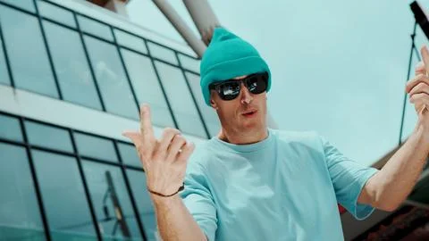 Caucasian dancer looking at camera while dancing at sky scrapper. Endeavor. Stock Photos