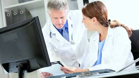 Caucasian Doctors Discussing Medical Information Stock Footage