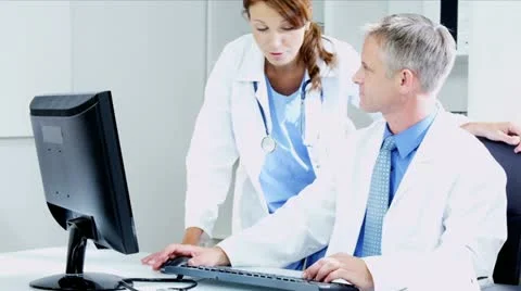 Caucasian Doctors Using Clinical Computer Data  Video stock 12139272