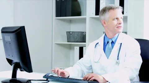 Caucasian Doctors Using Clinical Computer Data  Video stock 12139309