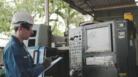 Caucasian Electrical engineer check machine mechanical. Wear hard hat Stock Footage 158681074