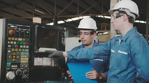 Caucasian Electrical engineer check machine mechanical. Wear hard hat Stock Footage 158681172