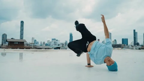 Caucasian energetic B-boy dancer practicing street dancing at rooftop. hiphop. Stock Footage 261784770