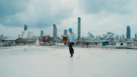 Caucasian energetic B-boy dancer practicing street dancing at rooftop. hiphop. Stock Footage 263515229