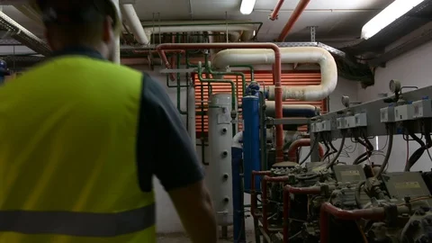 Caucasian Engineer with beard checking Cooling system, For the safety of the sys 스톡 동영상 108548408