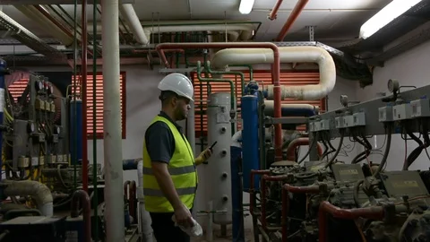 Caucasian Engineer with beard checking Cooling system, For the safety of the sys 스톡 동영상 108548587