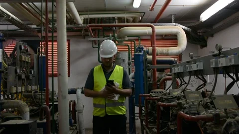 Caucasian Engineer with beard checking Cooling system, For the safety of the sys 스톡 동영상 108548621