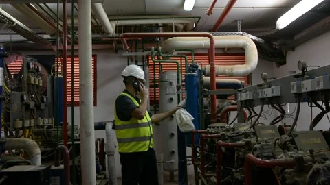 Caucasian Engineer with beard checking Cooling system, For the safety of the sys Stock Footage 108548900