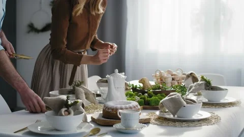 Caucasian family preparing  table for easter dinner Stock Footage 170875590