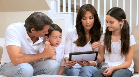 Caucasian Family Using Wireless Tablet Stock Footage 2975601
