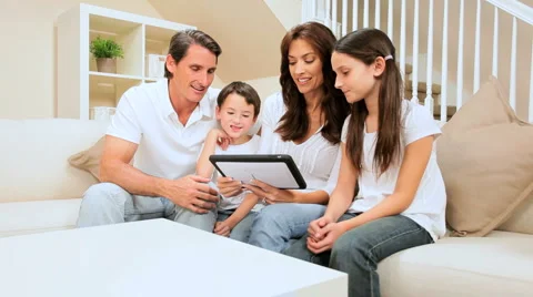 Caucasian Family Using Wireless Tablet at Home Stock Footage 4279509
