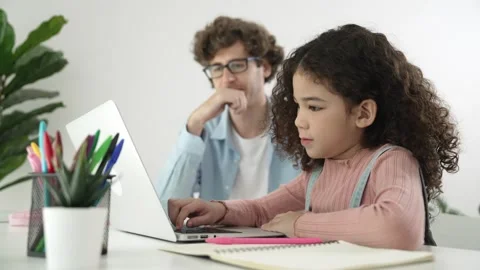 Caucasian father help student doing homework about engineering code. Pedagogy. Stock Footage 277355679