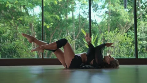 Caucasian female dancer performing modern choreography, looking at camera Stock Footage 245372902