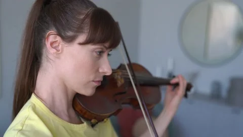 Caucasian female doing Exercises to Improve her Violin. Practice Time at home. Stock Footage 155111609