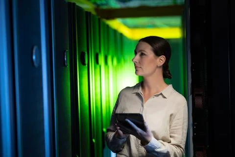 Caucasian female engineer using digital tablet while inspecting in computer Stock Photos