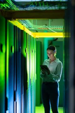 Caucasian female engineer using digital tablet while inspecting in computer Stock Photos