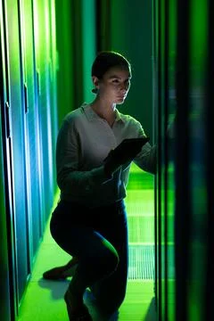 Caucasian female engineer using digital tablet while inspecting in computer Stock Photos