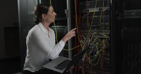 Caucasian female it technician using laptop, pointing and checking computer Stock Footage 342017609
