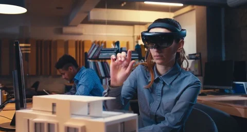 Caucasian female professional architect using augmented reality AR headset Stock Footage