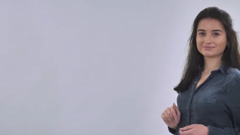 Caucasian female showing on empty space Stock Footage 83342182