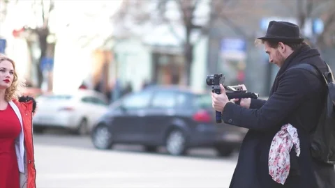 Caucasian Filmmaker Walking Around Model Stock Footage 73025559