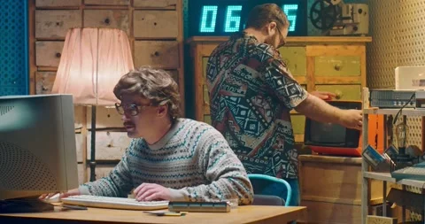 Caucasian funny computer programist nerd in glasses working at vintage PC Stock-Footage 135630274