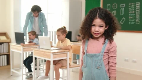 Caucasian girl looking at camera while friend studying about code. Pedagogy. Stock Footage 278826947