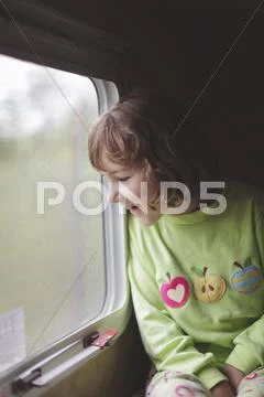 Caucasian Girl Looking Out Train Window