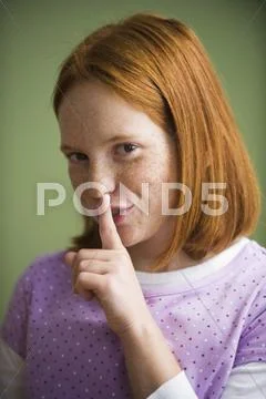 Caucasian girl making shhh gesture Stock Photos