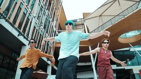 Caucasian group practice break dancing together. Low angle view. Endeavor. Stockfoto's