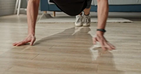 Caucasian guy keeping himself fit during lockdown. Sporty guy is doing push ups Video stock 137464292