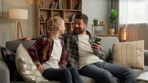 Caucasian guy man parent daddy dad using mobile phone relax happy positive Stock Footage 295882501
