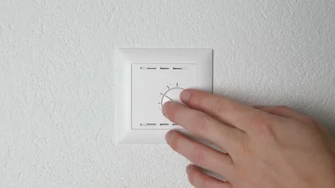 Caucasian hand increasing temperature to the maximum heat with modern control. Video stock 147848950