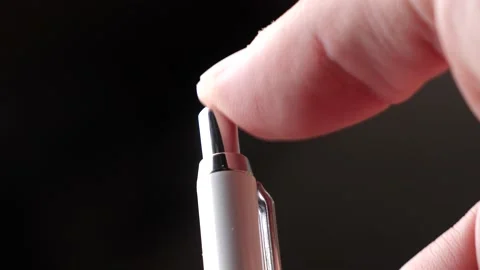 Caucasian hand presses the button of a ballpoint pen, extreme close up Stock Footage 162940467