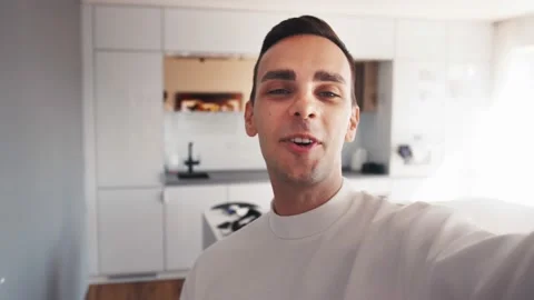 Caucasian influence holding camera for vlogging at home, or doing video call Stock-Footage 138904201