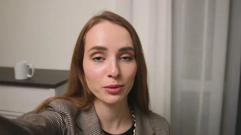 Caucasian influence holding camera for vlogging at home, or doing video call Stock-Footage 150399876