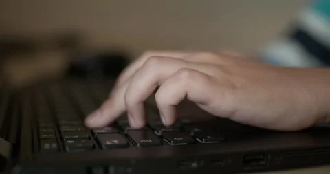 Caucasian kid hands type on keyboard. Boy use laptop computer. 4K 10-bit Vídeo Stock 345223170