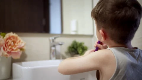 Caucasian kid with white tooth looking at mirror isolated at home. Portrait cute Stock Footage 179902168