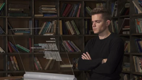 Caucasian male app tester looking at program code analysed by AI Stock Footage 97495553