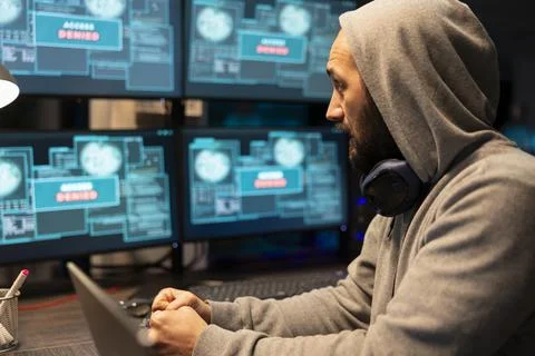 Caucasian Male Developer Debugging Code in Night Office Stock Photos