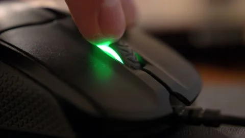 Caucasian Male Hand Using Computer Mouse Buttons and Wheel in the Dark Close Up Stock Footage 145261703