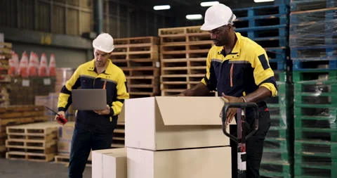 Caucasian male warehouse supervisor using tablet to check inventory while Stock Footage 324773252