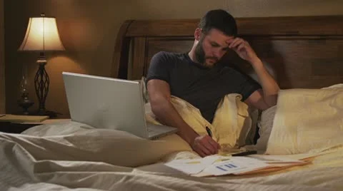 Caucasian Male Working In Bed Day Upset Stock Footage