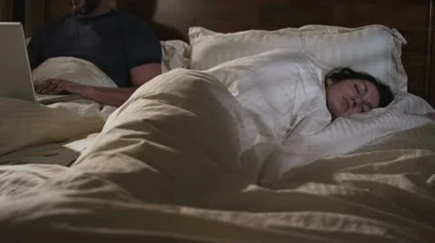 Caucasian Male Working In Bed Night Caught Stock Footage