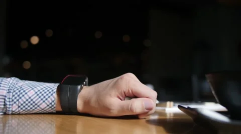 Caucasian man adjusting his smart watch. Close up of hands Stockbeeldmateriaal 64093631