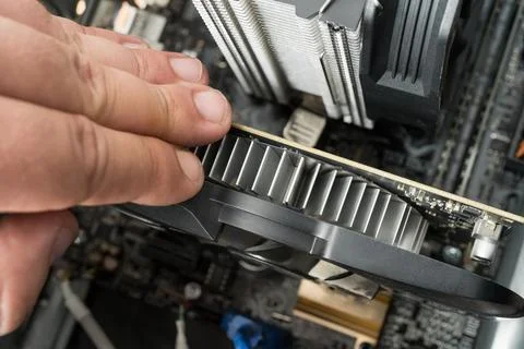 Caucasian man assembling pc computer internal parts. Stock Photos