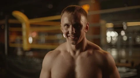 Caucasian man boxer looking at camera with serious look and smiling Stock Footage 271407178
