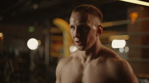 Caucasian man boxer looking at camera with serious look and smiling Stock Footage 271407231